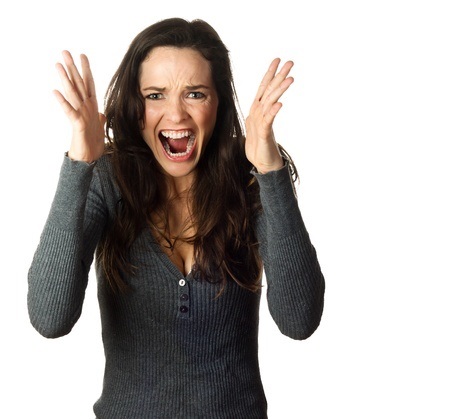 12338902 - a very frustrated and angry woman screaming. isolated on white.